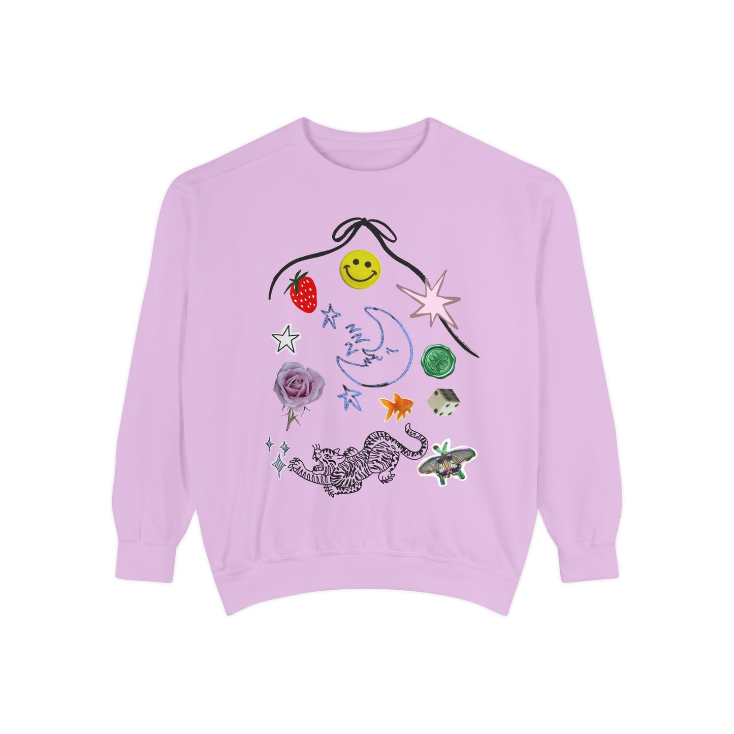 A light purple crewneck sweatshirt featuring a whimsical graphic collage of various doodles including a smiley face, strawberry, star, moon, cat, butterfly, and other small illustrations on a solid white background.