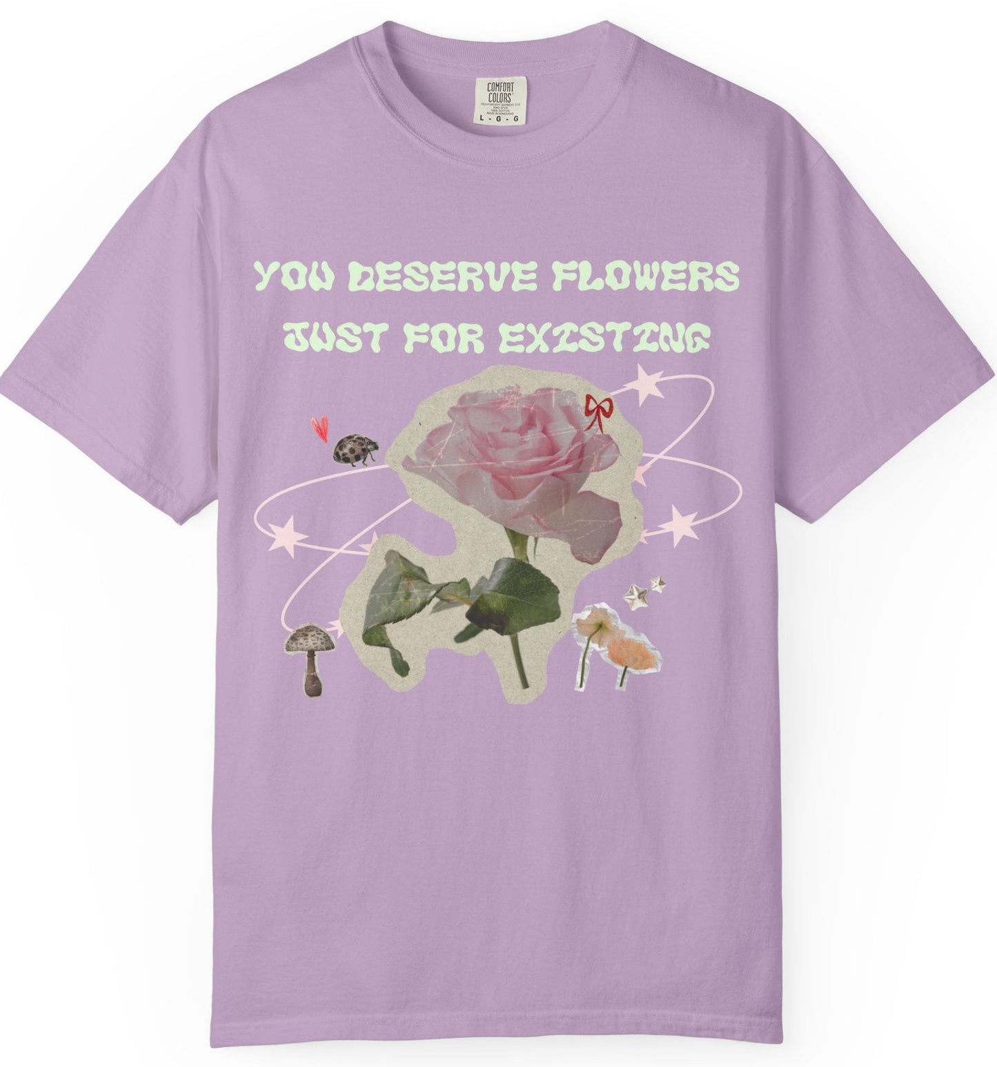 An purple t-shirt with a graphic print of a rose and the text 'YOU DESERVE FLOWERS JUST FOR EXISTING',floral tee,comfy t shirt,Loveworldllc,mental health brand,mom brand,self love T-shirt,gifts for her, gifts for mom,Loveworldllc.com