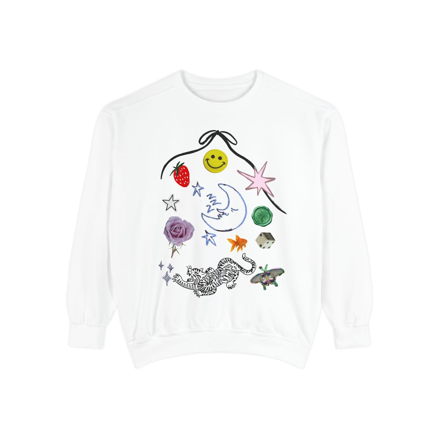 A white crewneck sweatshirt featuring a whimsical, hand-drawn style graphic print on the front with various colorful doodles including a smiley face, strawberry, moon, stars, a flower, a butterfly, and a leopard.