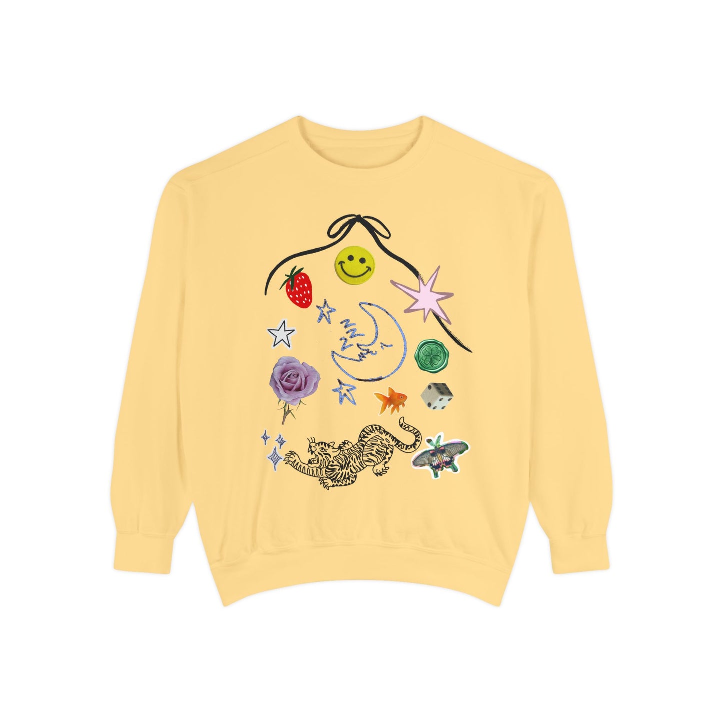 A pale yellow crewneck sweatshirt featuring a whimsical, multi-colored graphic print on the front with a smiley face, strawberry, stars, a crescent moon, a rose, a leopard, and a butterfly.
