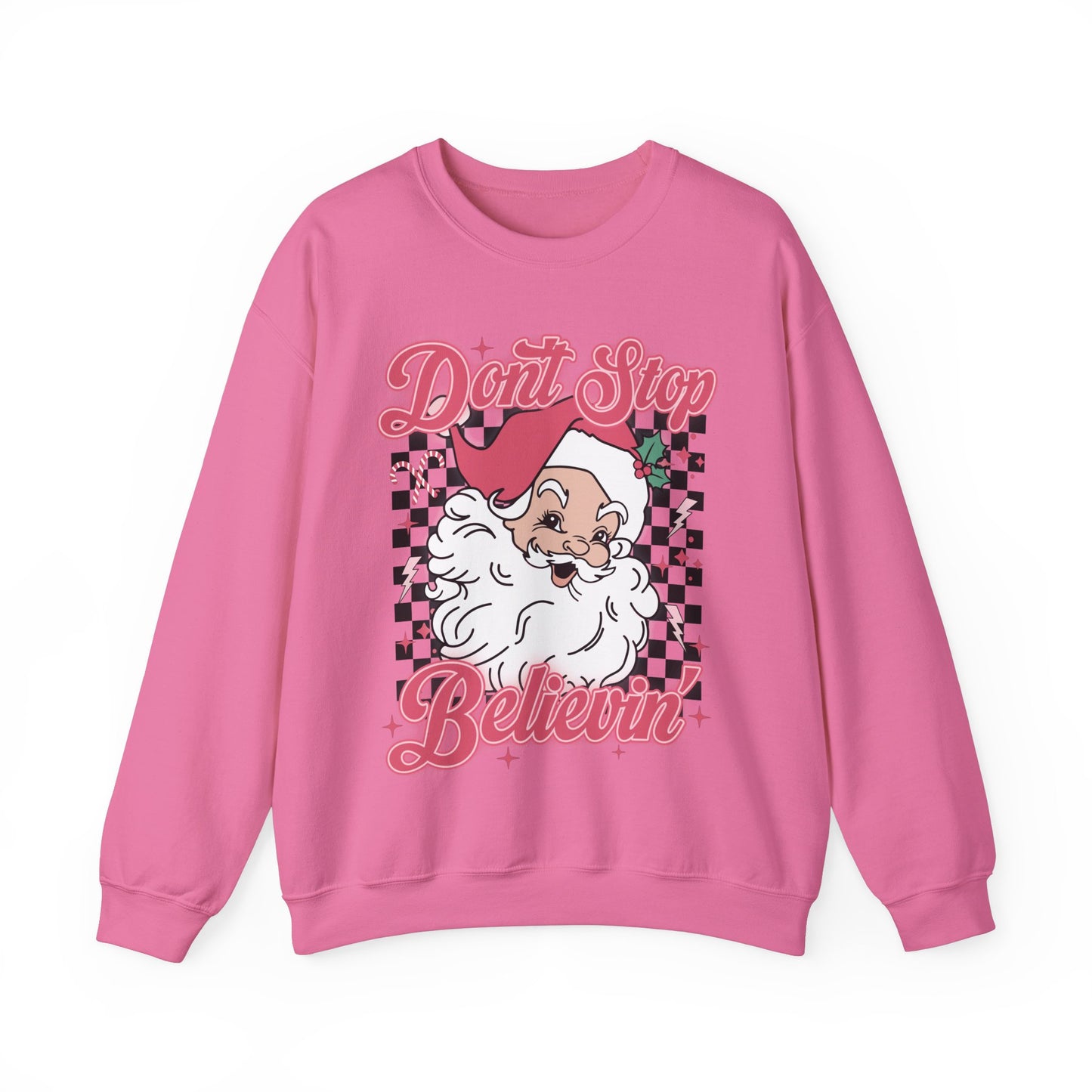 A pink crewneck sweatshirt with a graphic of Santa Claus and the text 'DON'T STOP BELIEVIN'.